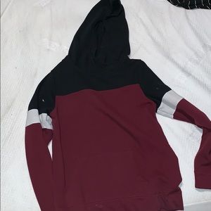 Red, black, and white hoodie.